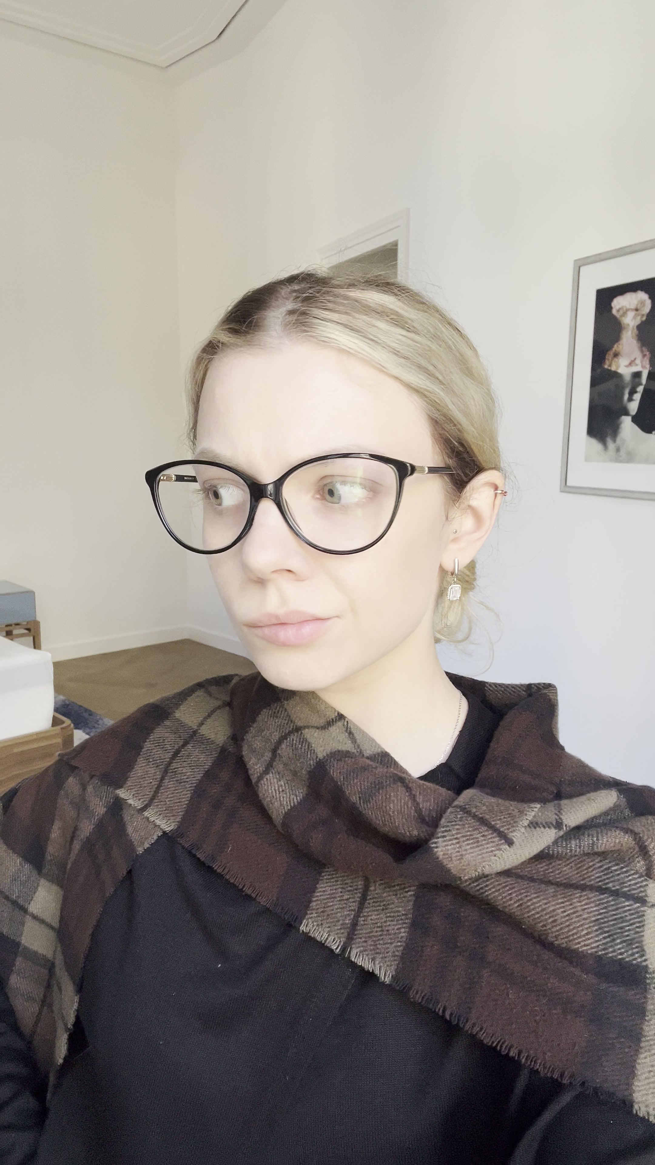 Woman in Glasses Looks Thoughtfully