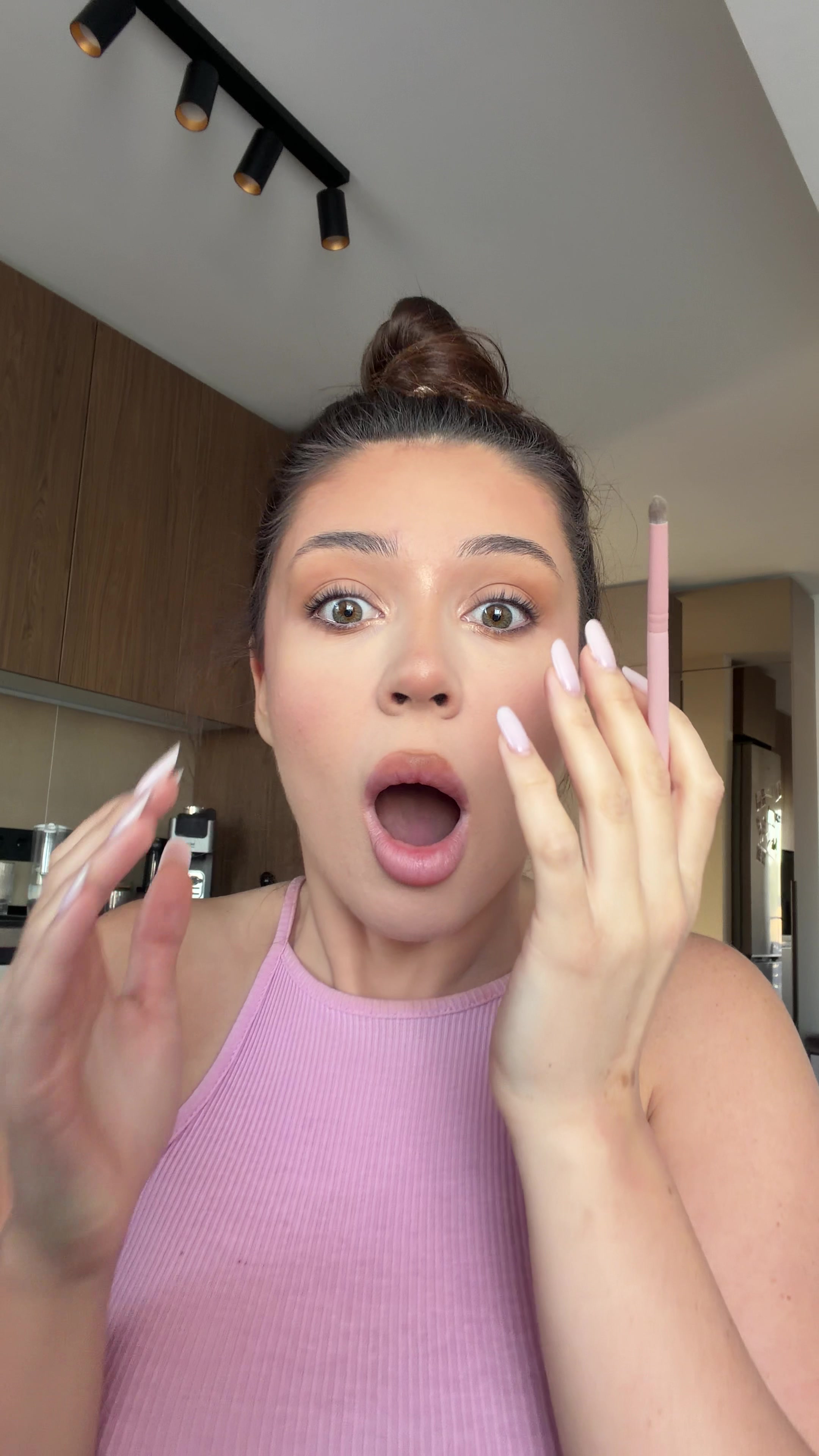 Woman shocked while doing makeup
