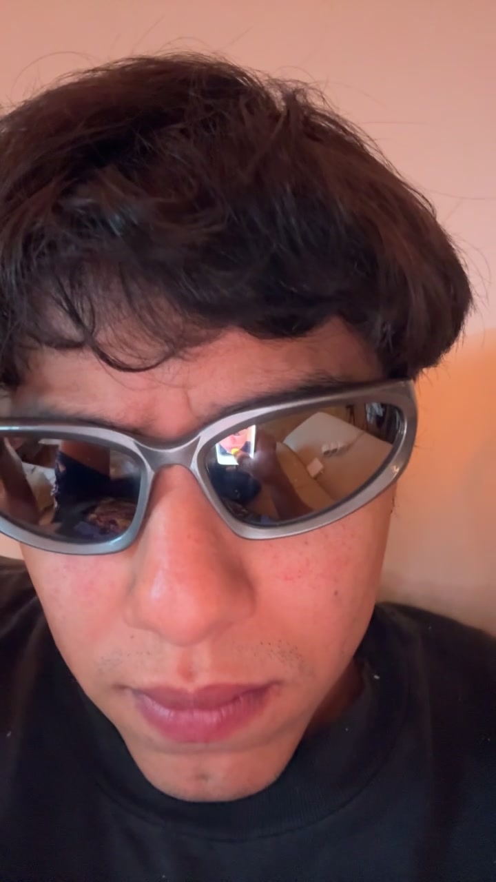 Carlos Looks Up with Sunglasses
