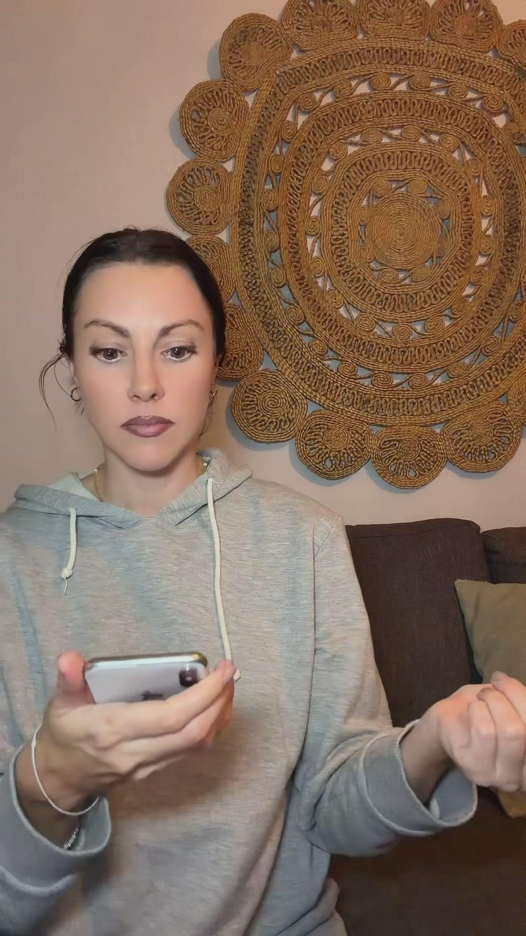 Shocked Woman Reacting to Smartphone Content