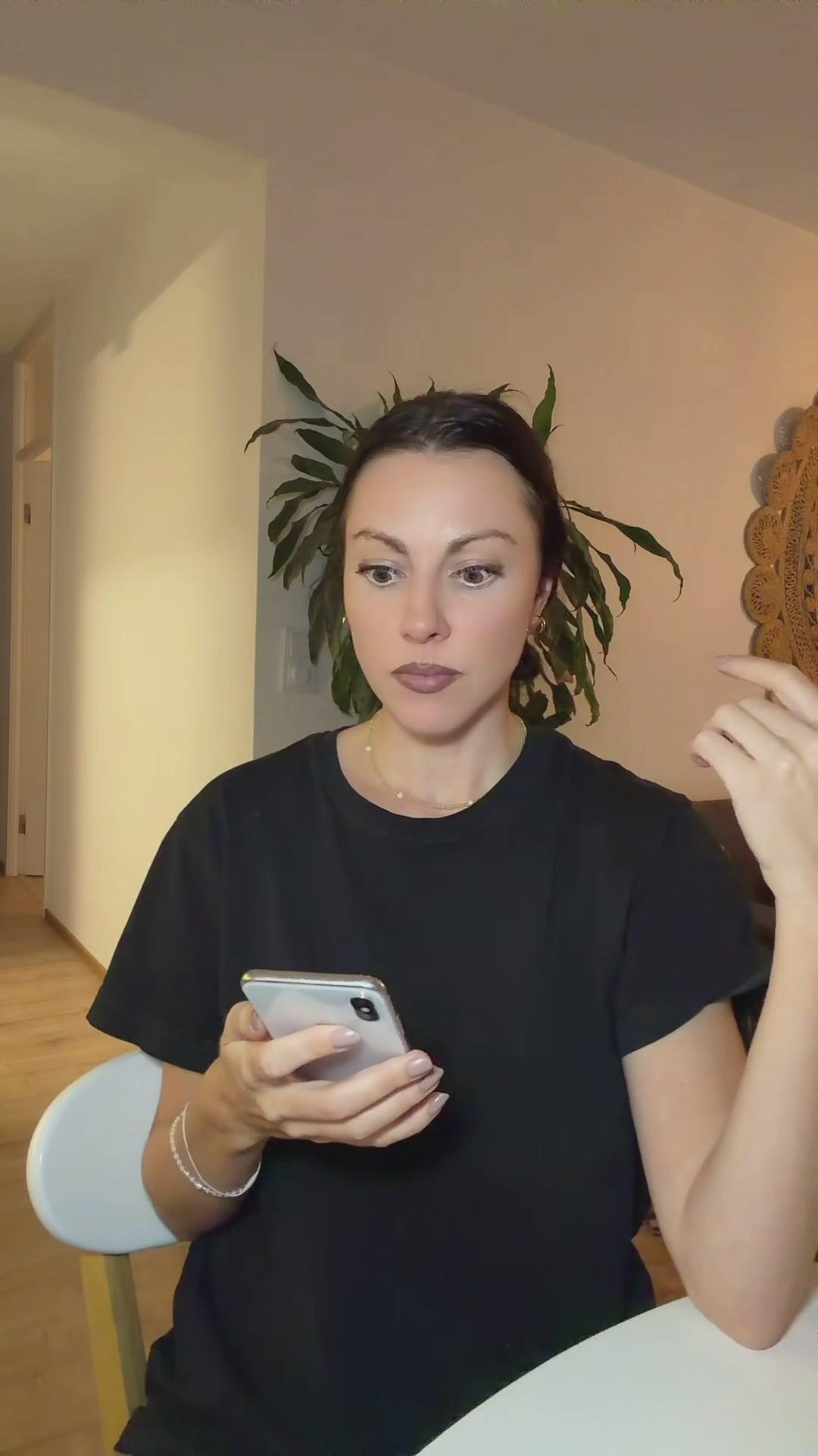 Shocked Woman Reacting to Smartphone Message