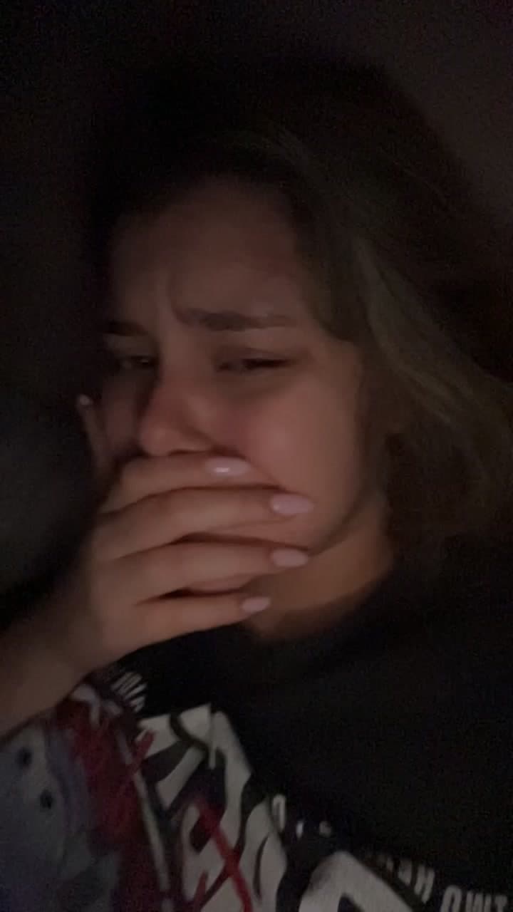 Emotional Woman Crying in Dim Light
