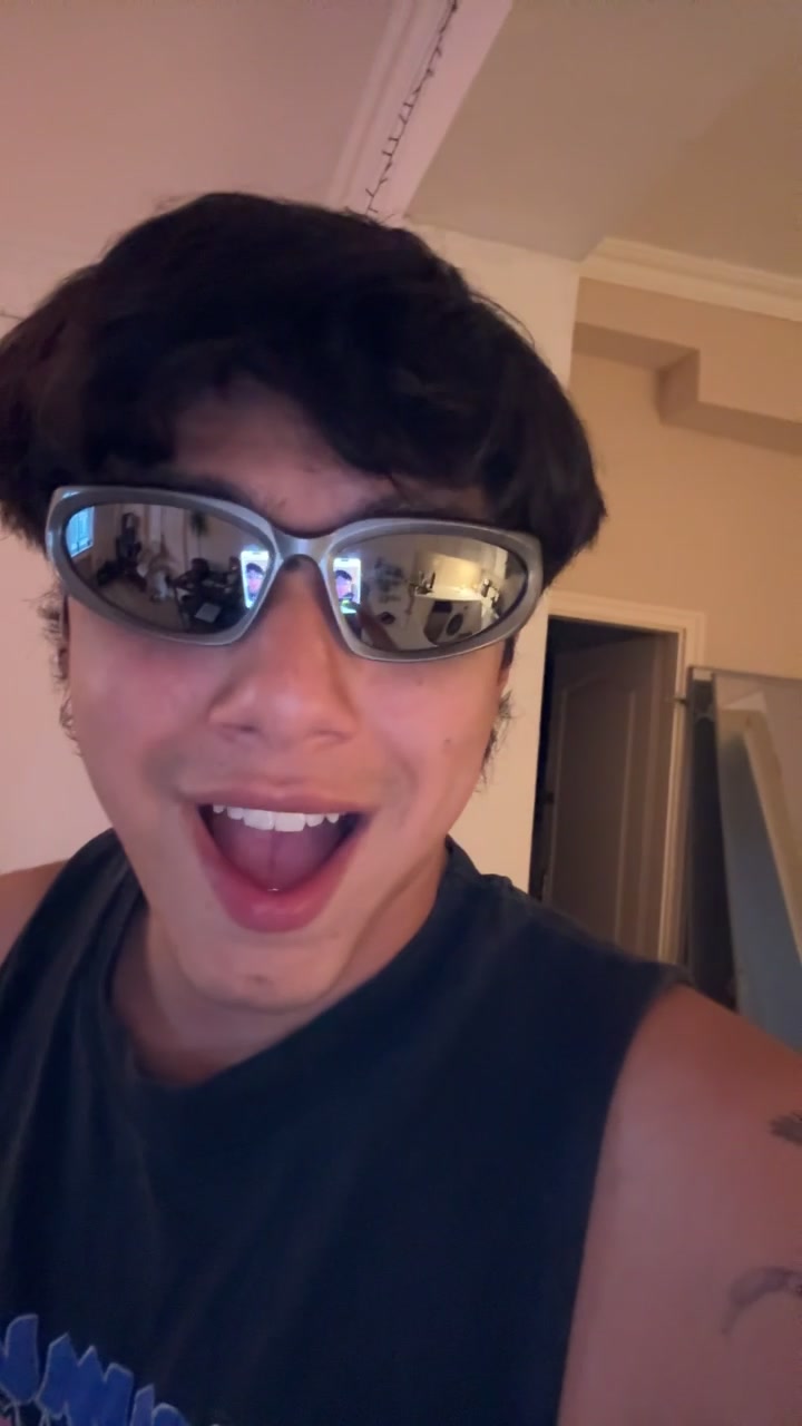 Carlos Playfully Reacts with Sunglasses Smile