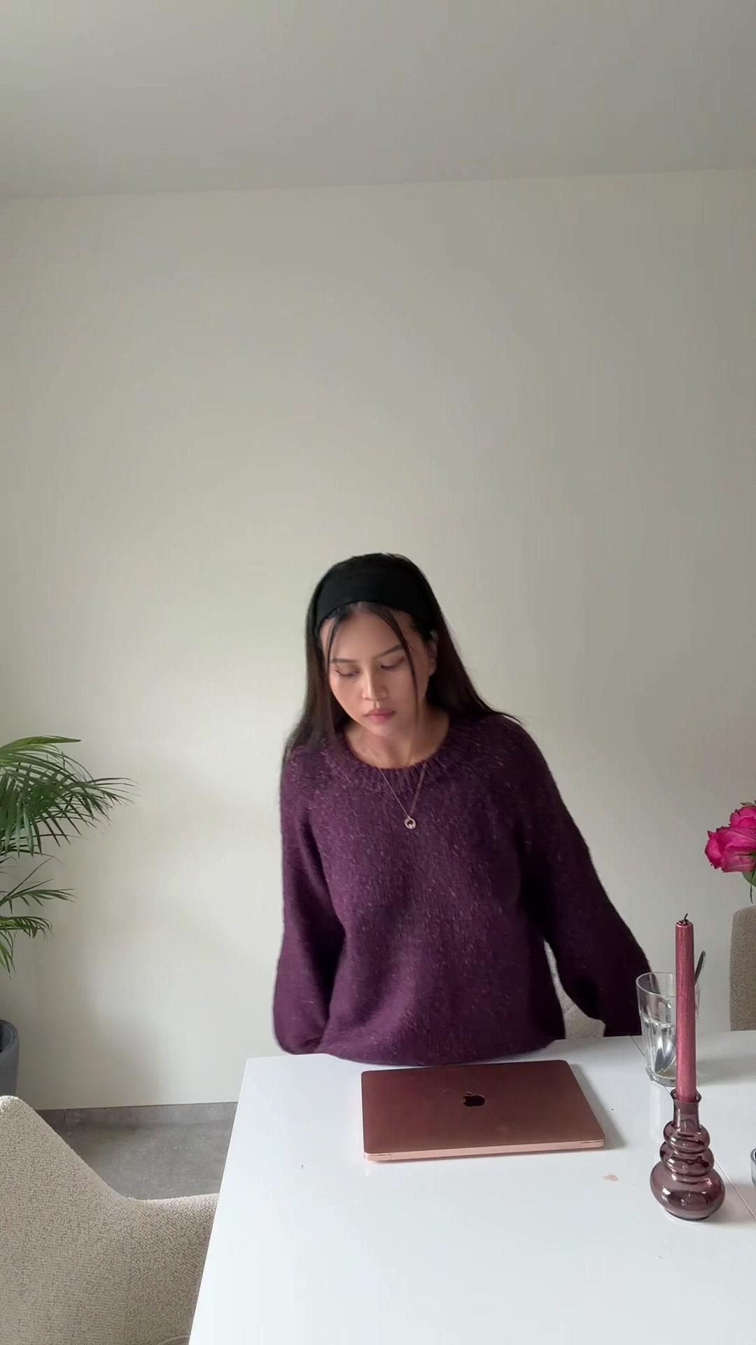 Woman Sits Down and Opens Laptop