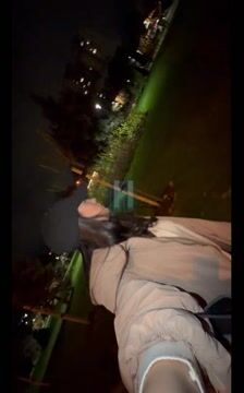 Woman looking out at city lights