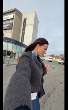 Woman walking past McDonald's